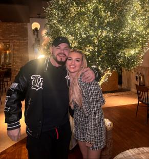 Photo of a man and woman posing together.