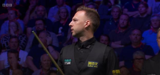 Snooker player at a tournament.