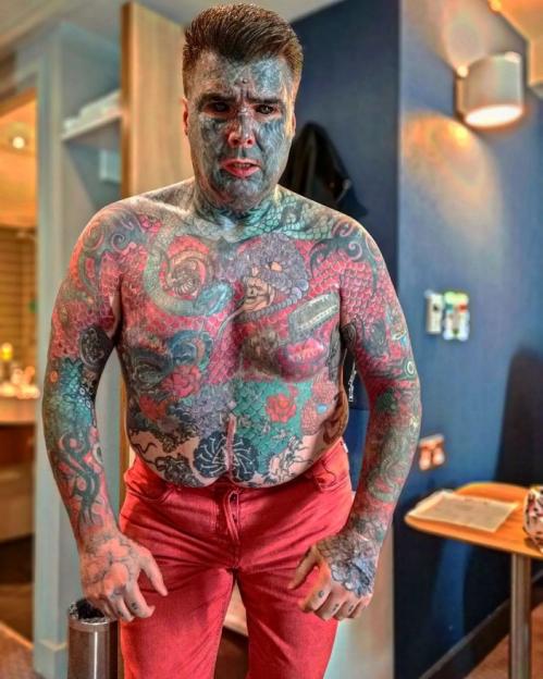 Story from Jam Press (Most Tattooed Man) Pictured: Since his interest in body modifications sparked at the age of 9, King Of Ink Land has had his nipples removed. 'Britain's Most Tattooed Man' is 'quitting the ink' to save money to pay off mortgage A man who has been dubbed Britains Most Tattooed Man reveals that hes giving up the ink for good until he clears his mortgage  but a new furry friend is helping him through. King Of Ink Land King Body Art The Extreme Ink-ite regularly hits the headlines due to his heavily inked look, where he says that the majority of his body is covered in colourful designs. Previously, the 43-year-old, revealed that his bank wouldnt let him open an account due to his new legal name, which used to be Mathew Whelan, that he has had since 2008. Now, the actor has revealed that hes giving up his lifestyle choice in a bid to clear his £66,000 mortgage and says he hopes to pay off the amount over the next four years. "Getting tattoos can be an addiction, however, this is a lifestyle for me, which I can start and pause whenever I please," King Of Ink Land, from Birmingham, told NeedToKnow.co.uk. Im taking a break from being inked while I concentrate on clearing my mortgage, so Ill be slowing down over the next few years. I might still get some ink every other year, but with interest rates going up, I hope to be mortgage-free in four years. I have a budgeting plan in place, and this means Ill have to limit my lifestyle, but Ill be happy to have that out of the way and done. King of Ink Land, who goes by Body Art for short, claims that hes spent over 1,500 hours under the needle and set the record in February 2016 when he had 36 tattooists work on him at once. While he hasnt kept track of the amount its cost him to date, he claims his bank manager would have rathered the money was kept in an ISA, rather than on his skin. Recently, hes welcomed an English Bulldog, Mary, 5, in