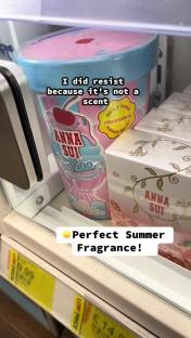 Anna Sui perfume displayed on a store shelf.