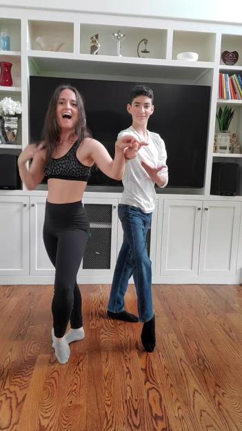 Danica McKellar dancing with her son.