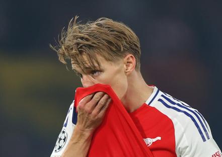 Martin Odegaard of Arsenal looking dejected during a soccer match.