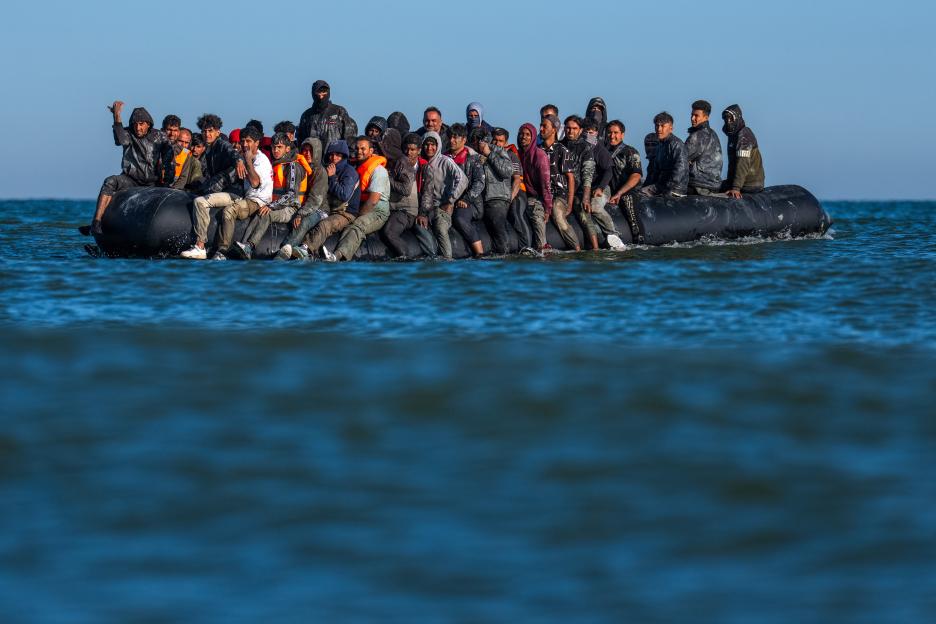 Migrants in a dinghy crossing the English Channel.