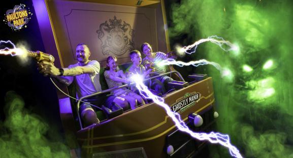 Family riding Ghostly Manor ride at Paultons Park.