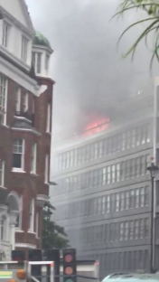 Huge fire rips through London tower block with flats engulfed in flames as 75 firefighters scrambled