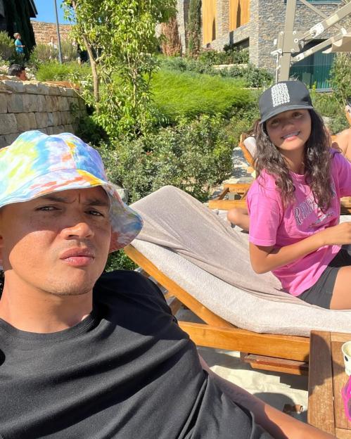 Jermaine Jenas-Keogh and his daughter Sancha relaxing outdoors.