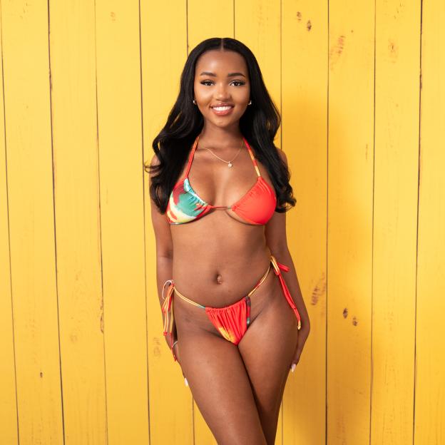 Diamanté Laiva in a red and orange bikini.