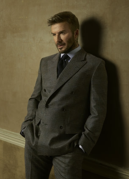 David Beckham in a gray double-breasted suit.