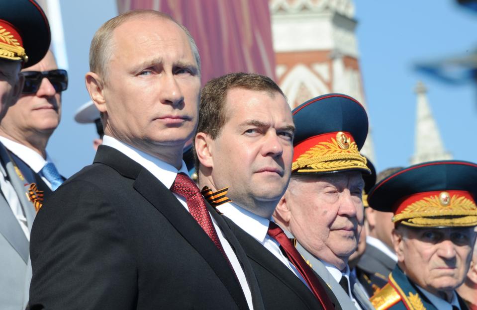 Vladimir Putin and Dmitry Medvedev at a Victory Day parade in Moscow.