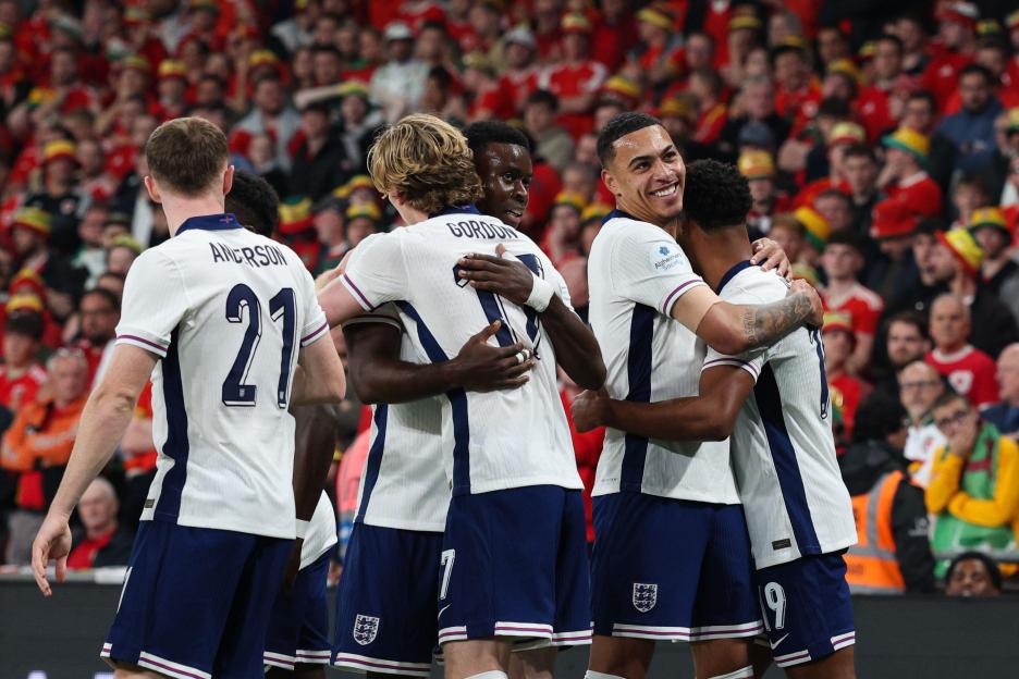 England players celebrate their side's second goal.