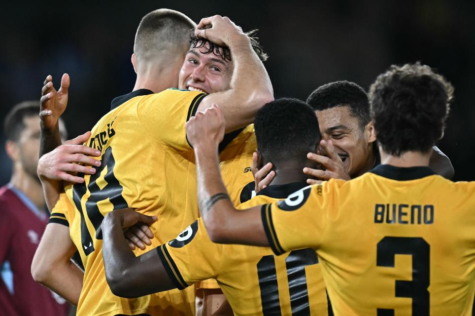 Wolverhampton Wanderers players celebrating a goal.