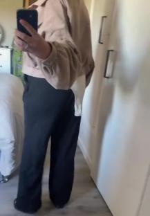 Woman realizing her outfit is mismatched after school drop-off.