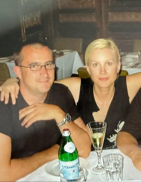Photo of a man and a woman sitting at a table together.