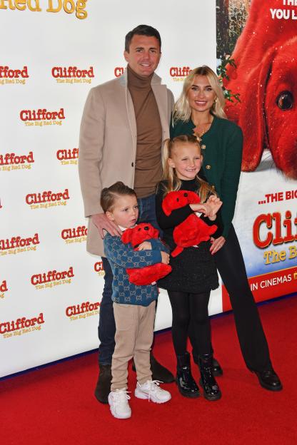 Greg Shepherd and Billie Faiers with their children at a *Clifford the Big Red Dog* film screening.