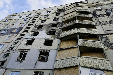 Damaged apartment building in Saltivka, East.