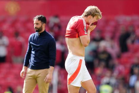 Rasmus Hojlund and his manager reacting after a soccer match.
