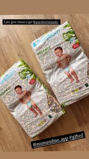 Two packages of PureBorn organic bamboo baby diapers.