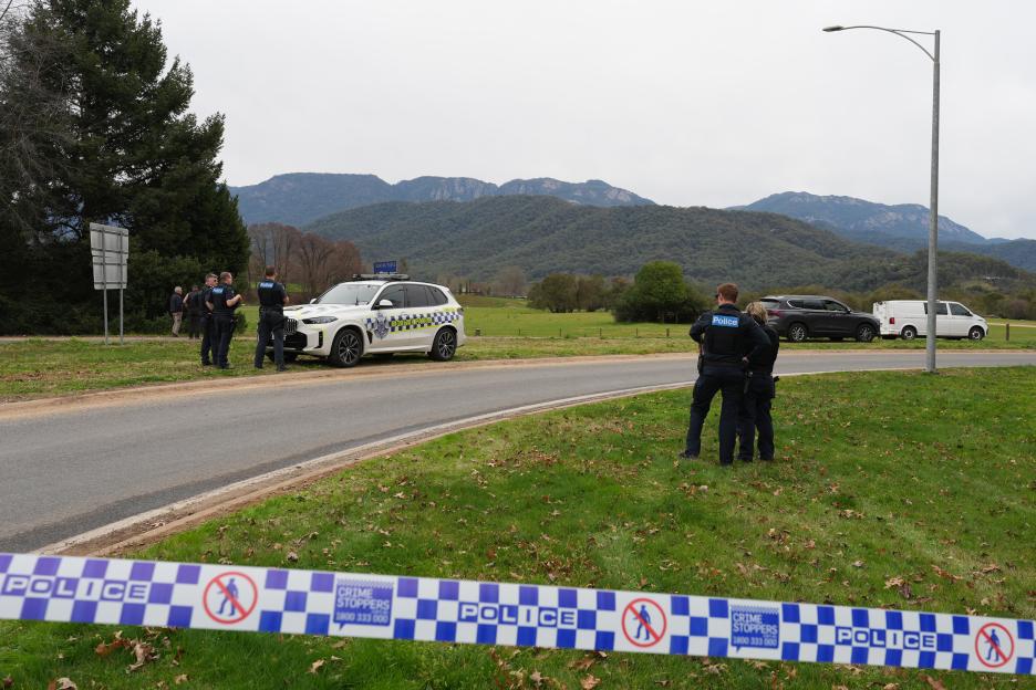 Police officers at a crime scene.