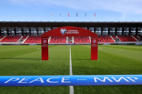 Empty soccer stadium before a UEFA Euro 2024 qualifier match.