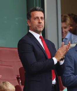Edu Gaspar, Arsenal's sporting director, applauding at a match.