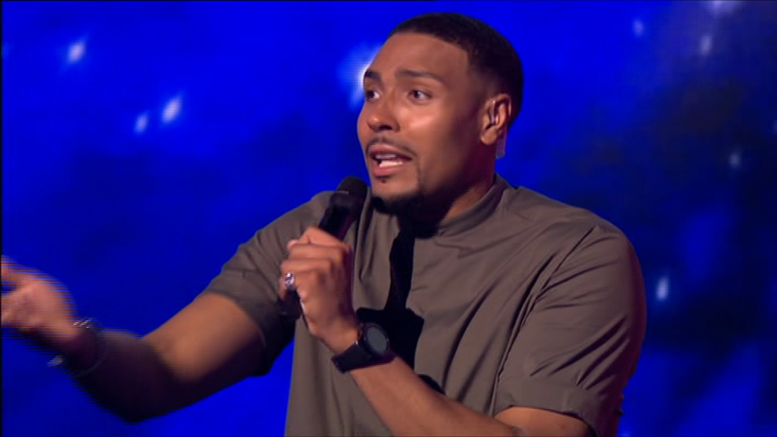 Man singing into a microphone.