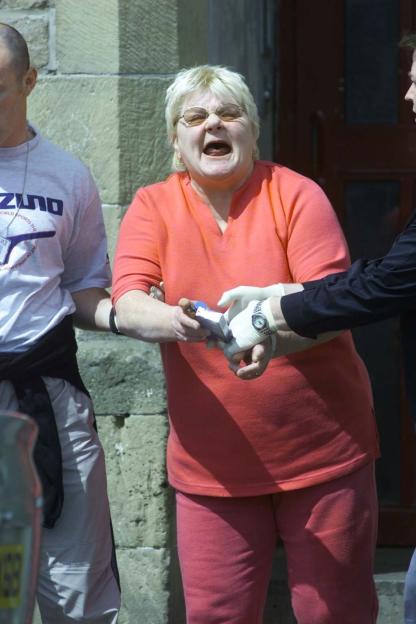 A drug dealer being arrested.