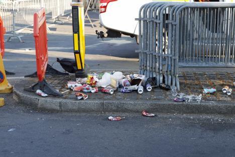 Litter on the ground near barriers.