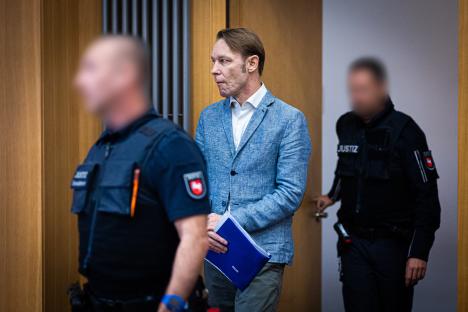Defendant Christian B. escorted into a courtroom.