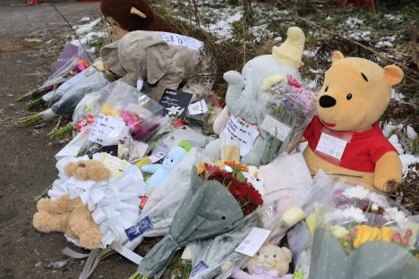 Memorial of flowers and stuffed animals left in tribute to baby Ava.