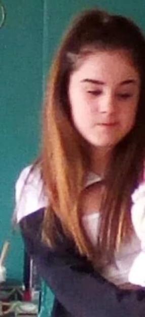 Photo of missing 16-year-old girl with long brown hair.