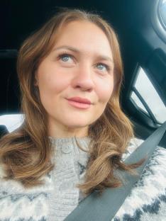 Woman looking out a car window.