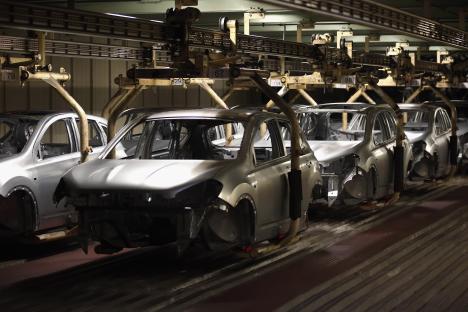 Car bodies on an automated assembly line.