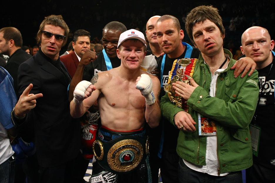 Liam and Noel Gallagher with Ricky Hatton and his boxing belt.