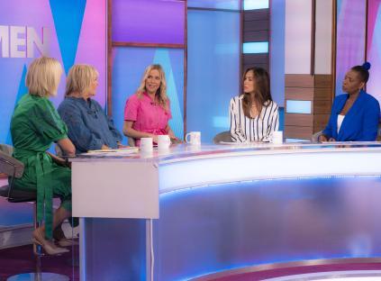 Five women sitting around a table on the set of the Loose Women TV show.