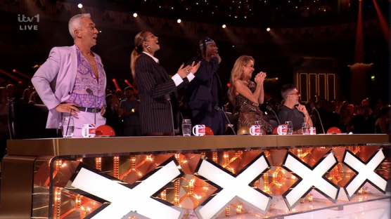 Screenshot of four judges at the X Factor judging panel.