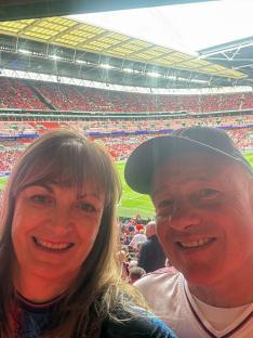 Couple at Wembley Stadium selfie.