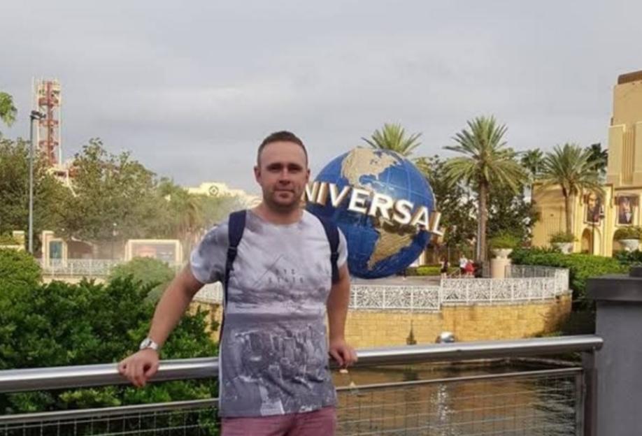 Man standing at Universal Studios Florida.
