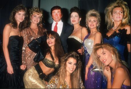 Photo of Bob Guccione with a group of women.