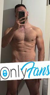 Man taking a selfie, OnlyFans logo obscuring genitals.