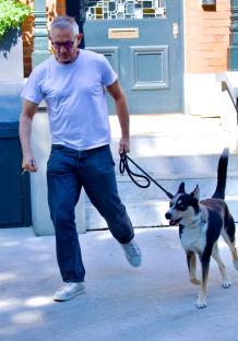Gary Lineker walking his dog.