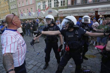Riot police confronting Chelsea fans.