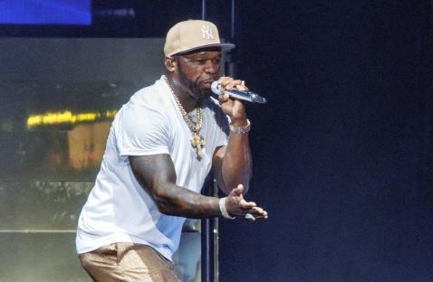 50 Cent performing on stage.