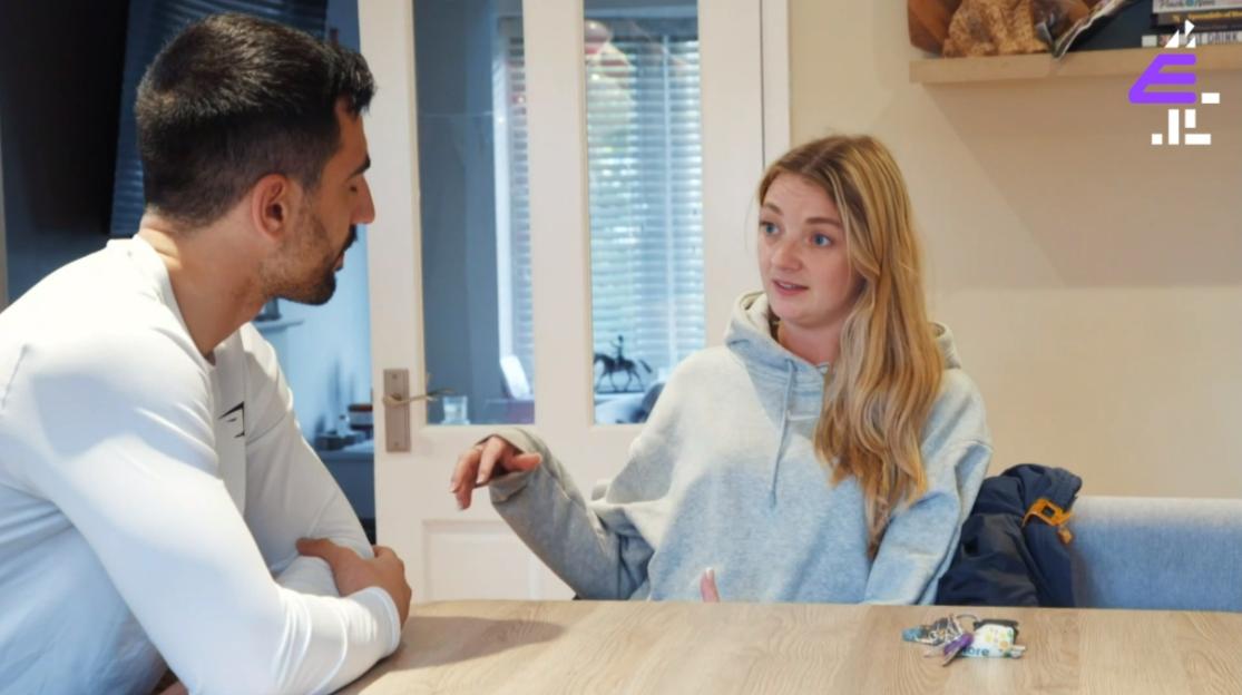 A man and woman having a serious conversation.
