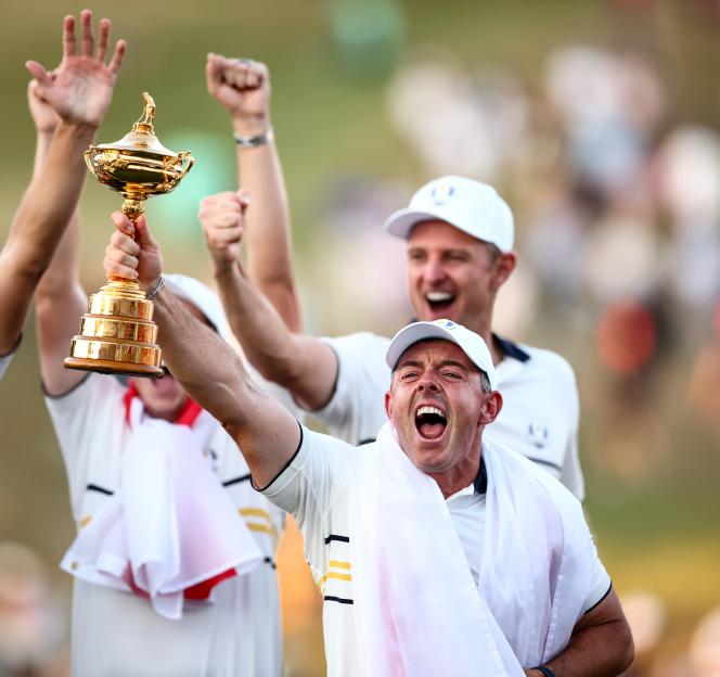 Rory McIlroy of Team Europe lifts the Ryder Cup.