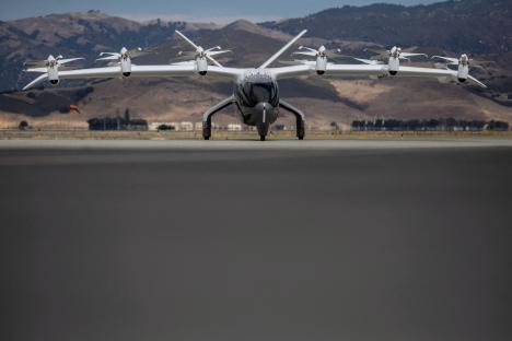 All-electric aircraft on airport tarmac.