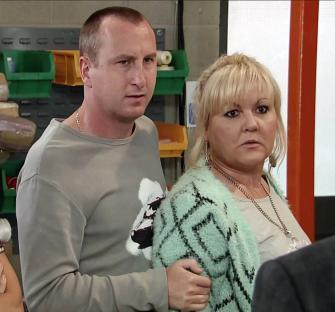 Screenshot from Coronation Street showing a tense scene between several characters.