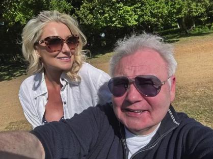 Selfie of Eamonn Holmes and Katie Alexander outdoors.