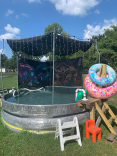DIY trampoline pool with tapestry backdrop.
