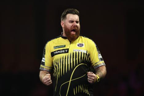 Scott Williams of England celebrates a darts victory.