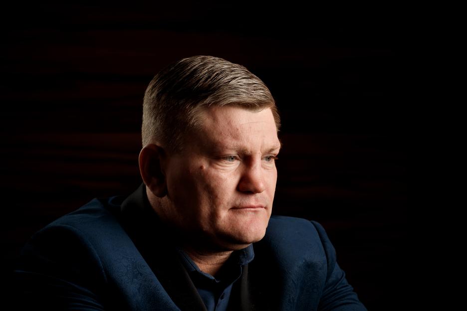 Ricky Hatton, a former world welterweight boxing champion, in a blue suit against a dark background.